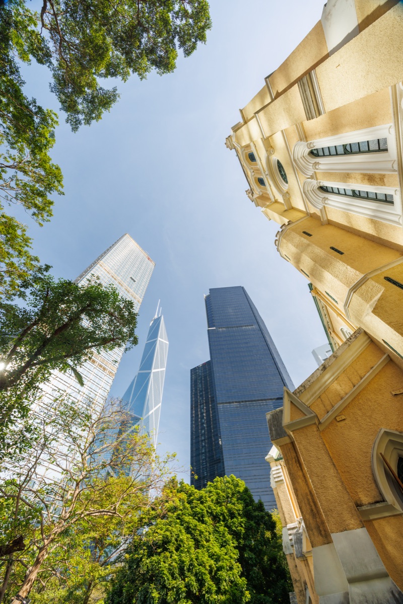 Modern skyscrapers and a historic cathedral in Hong Kong, contrast of contemporary and traditional architecture