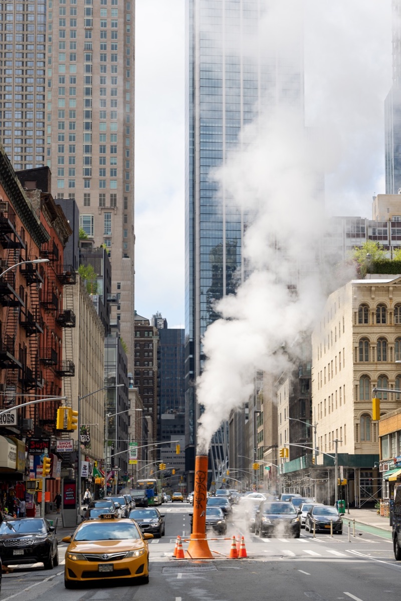 Steam and yellow taxi in Lower Manhattan