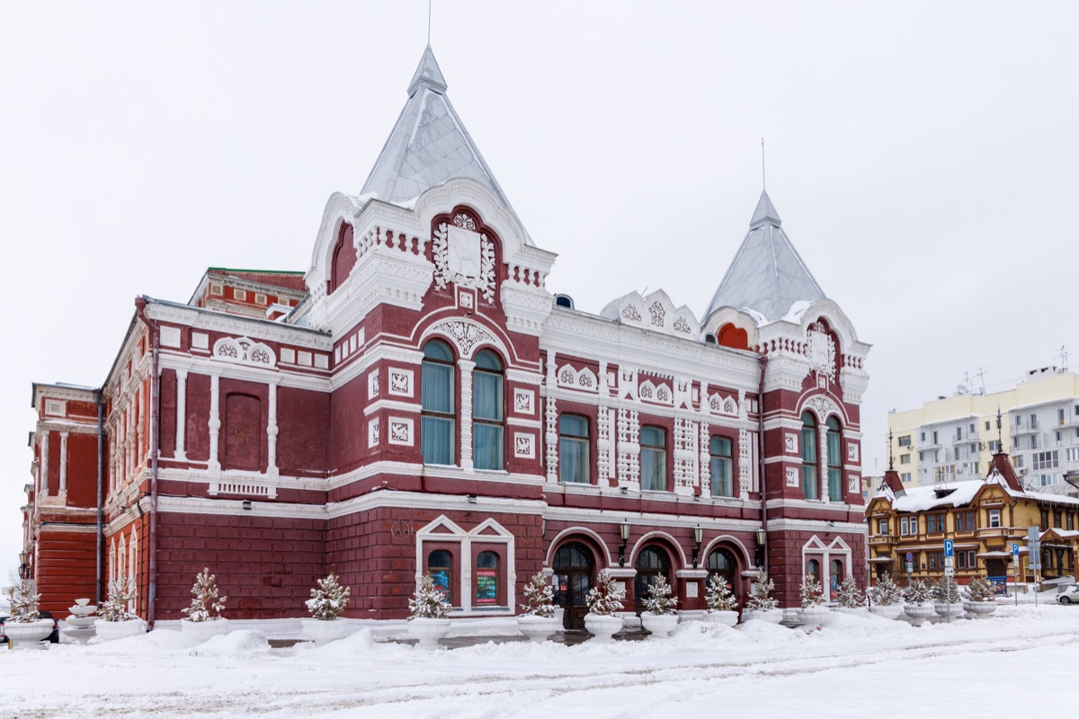 Snow covered streets and iconic landmarks of Samara city during winter season with urban life and architecture