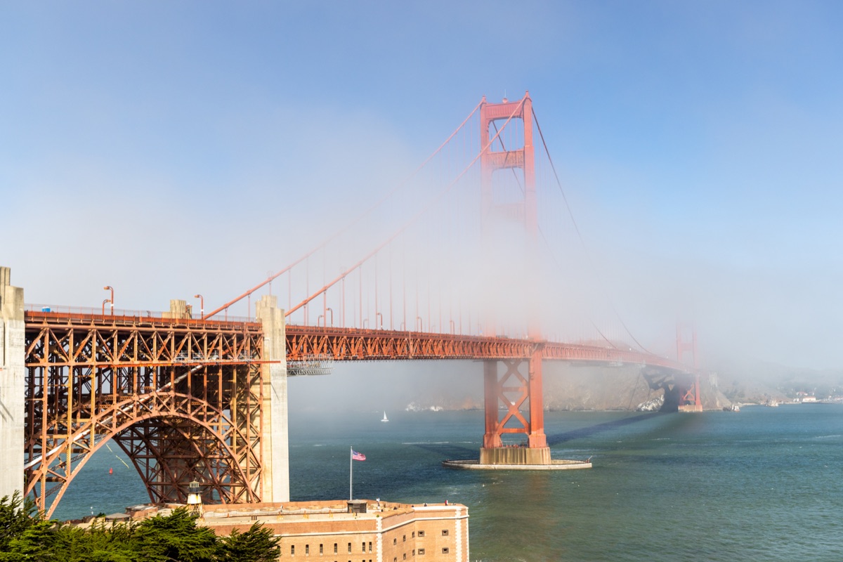 Golden Gate Bridge covered by clouds, San Francisco, California